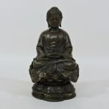 A bronzed figure of a buddha,