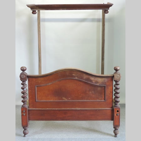 A Victorian mahogany half tester double bedstead,