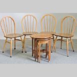 A set of four Ercol stick back dining chairs,