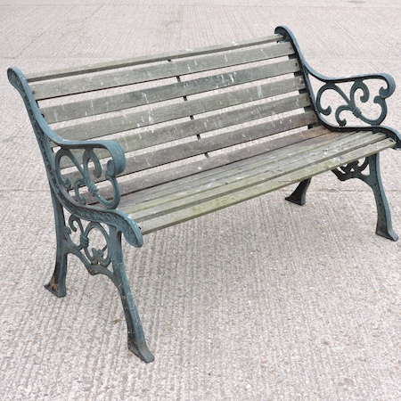 A cast iron and slatted hardwood garden bench,