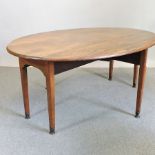 A George III mahogany wakes table, with a hinged oval top,