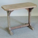 An early 20th century limed oak side table, bearing a label for Heal & Son,