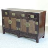 A 20th century elm and rattan sideboard,