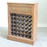 A reproduction oak thirty six bottle wine rack,