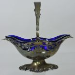 An Edwardian silver basket, of pierced scalloped shape,