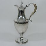 A Victorian silver claret jug, of Neoclassical pedestal shape,