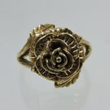 A 9 carat gold ladies ring, in the form of a rose head,