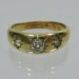 An 18 carat gold diamond set gypsy ring,