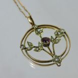An Edwardian unmarked seed pearl openwork pendant, on the form of a flower, on chain,