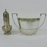 A George III silver twin handled sugar bowl, of oval shape, with half gadrooned decoration,