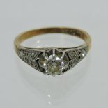 An 18 carat gold and platinum set single stone diamond ring,