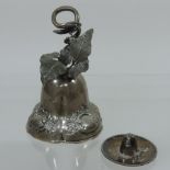 An early 20th century silver table bell, of lobed circular shape with an entwined vine handle,