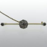 An early 20th century unmarked gold and diamond bar brooch,