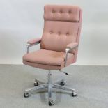 A 1980's aluminium and pink upholstered swivel desk chair