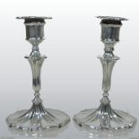 A pair of Edwardian silver table candlesticks, with removable scones, on knopped stems,