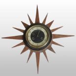 A 1960's Andrew sunburst teak wall clock,