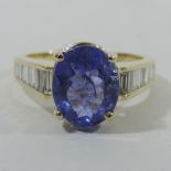 An 18 carat gold tanzanite and diamond ring, approx.