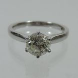 An 18 carat white gold solitaire diamond ring, the brilliant cut stone approximately 1.