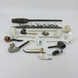 A collection of continental wooden and clay pipes