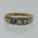 An 18 carat gold diamond and sapphire ring, of boat shape,