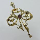 An Edwardian gold, seed pearl and amethyst set pendant, of openwork design,