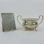 An early 20th century silver twin handled sugar bowl, 17cm diameter overall,