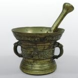 An 18th century Dutch gilt bronze pestle and mortar, of twin handled form,