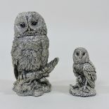 A pair of filled sterling silver models of owls,