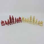 An early 20th century Chinese stained bone chess set,
