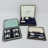 A silver part condiment set, together with a set of teaspoons and a christening set,