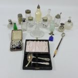 A collection of silver mounted and other dressing table jars,