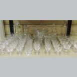 A collection of cut glass drinking glasses,