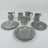 A collection of 19th century and later pewter mugs and plates