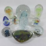 A collection of coloured glass dump weights and paperweights, to include a large glass paperweight,