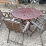 A teak circular garden table, 120cm diameter,