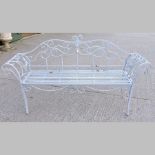 A grey painted iron garden bench, with scrolled arms,