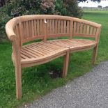 A teak Malborough Banana bench, as new,