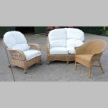 A 20th century wicker patio suite, to include a sofa, 132cm, two chairs, a glazed coffee table,