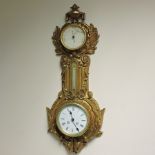 A 19th century ormolu cased wall clock and barometer, inscribed, J.J. Wainwright and Co.