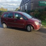 A red 2004 Vauxhall Meriva, registration PG04 MFY,