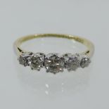 A ladies 18 carat gold five stone graduated diamond ring