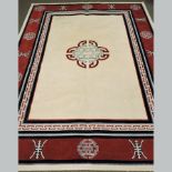 A Chinese rug, 240 x 170cm, together with a small woollen rug, on a cream ground,