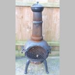 A black painted garden chiminea,