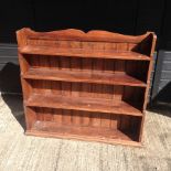 A stained pine plate rack,