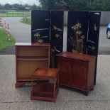 An early 20th century embroidered four fold dressing screen, together with a yew wood cabinet,