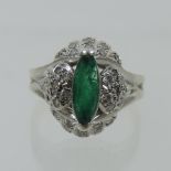 An unmarked emerald and diamond cluster ring,