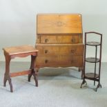 A 20th century walnut bureau, 77cm, together with a folding cakestand, two fire screens,