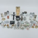 A collection of lighters, watches and badges, together with coins,
