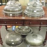A collection of 19th century and later silver plated cloches