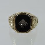 A gentleman's 9 carat gold and jet mounted signet ring,